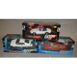 Three boxed Autoart 1:18 scale diecast model cars from their 'James Bond 007' range,