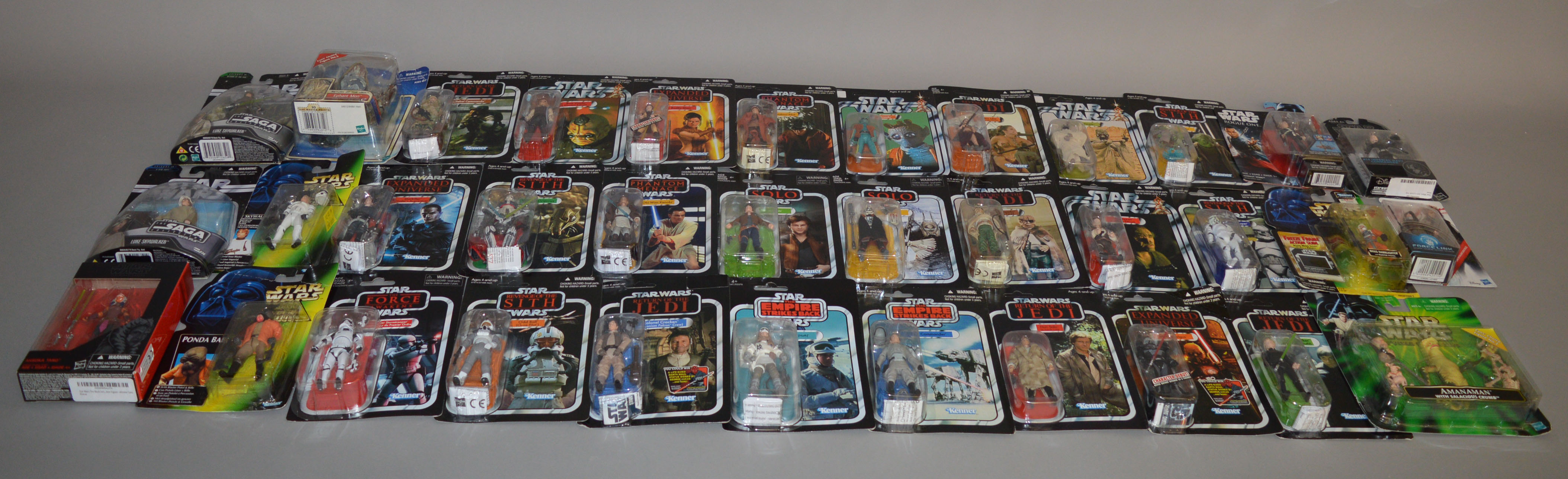 Thirty five carded Star Wars figures by Kenner and Hasbro from a variety of collection series which