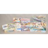 Sixteen boxed aviation and military model kits in a variety of different scales by Hasegawa,