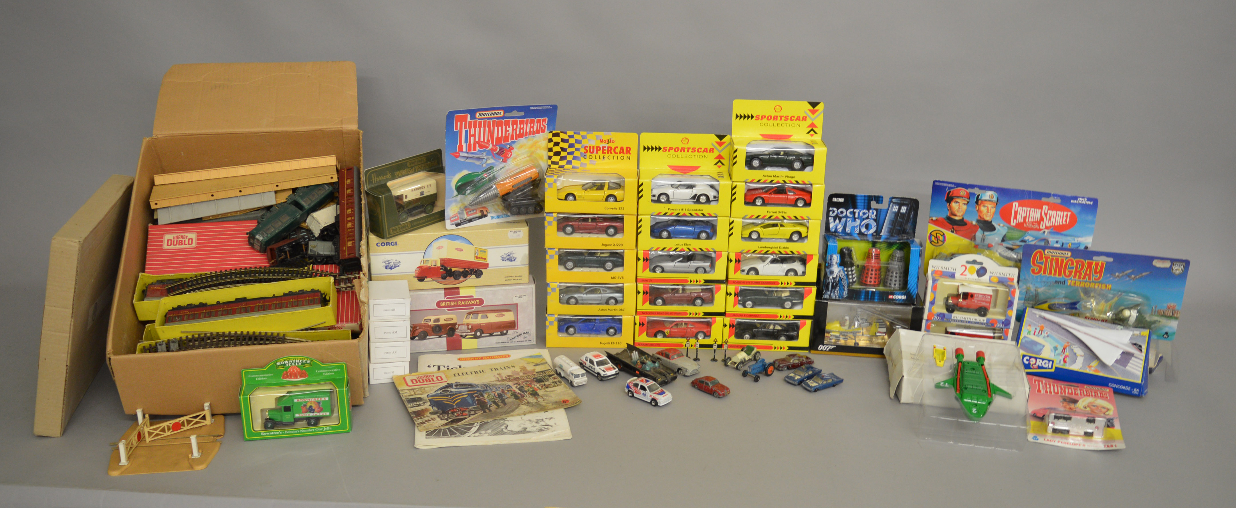 A mixed lot containing a quantity of boxed and carded diecast models by Corgi,