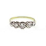 A five stone diamond ring stamped 18ct, the five round brilliant cut diamonds total approx 0.