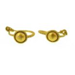 A pair of earrings which are believed to be Roman,