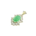 A 14ct H/M jade & diamond pendant, the oval jade measures approx 18mm x 13mm,