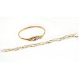 A yellow bangle stamped 585, together with a bracelet stamped 14kt,