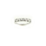 An 18ct H/M diamond five stone ring, the five round brilliant cut diamonds total approx 0.