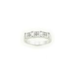 A diamond ring, stamped 18k, the baguette & princess cut diamonds total approx 0.