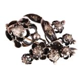 A Victorian diamond set floral brooch, unmarked silver & gold set,