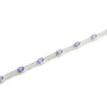 A tanzanite & diamond bracelet, the ten oval tanzanites total approx 5.