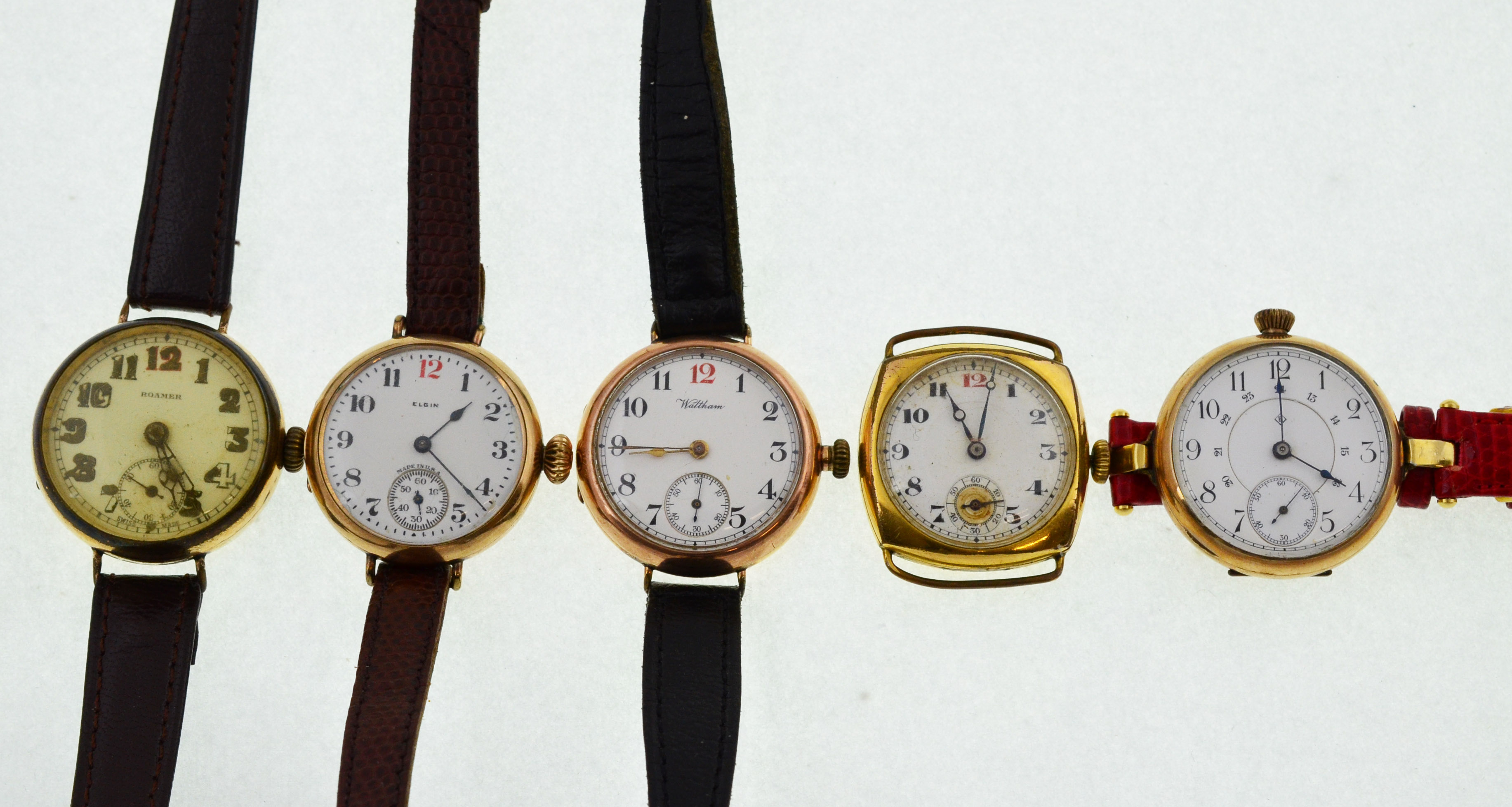 Five early 20th century gold-plated mechanical watches to include Waltham, Elgin, Roamer etc,