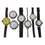 Seven early 20th century mechanical watches, four with uncracked white enamel dials,