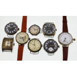 Eight early 20th century silver mechanical watches, three with black dials,