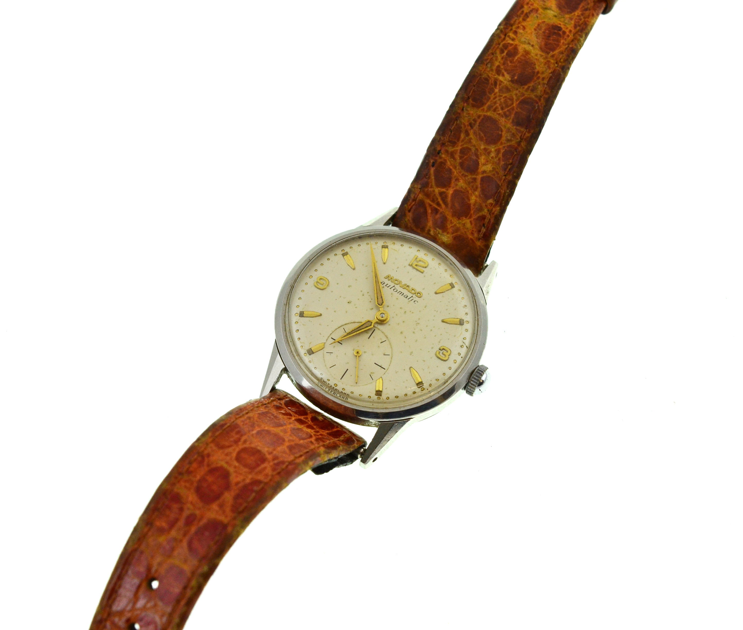 A circa 1950's Automatic Movado steel wristwatch, approx 32mm, moisture marks to silvered dial,