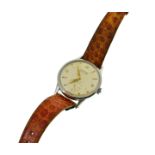 A circa 1950's Automatic Movado steel wristwatch, approx 32mm, moisture marks to silvered dial,