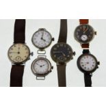 Six early 20th century mechanical nickel watches, to include two black enamel dial examples,