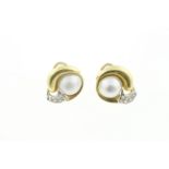 A pair of mabe pearl set earrings, stamped 750 (18 ct) set with CZ stones, approx gross weight 11.