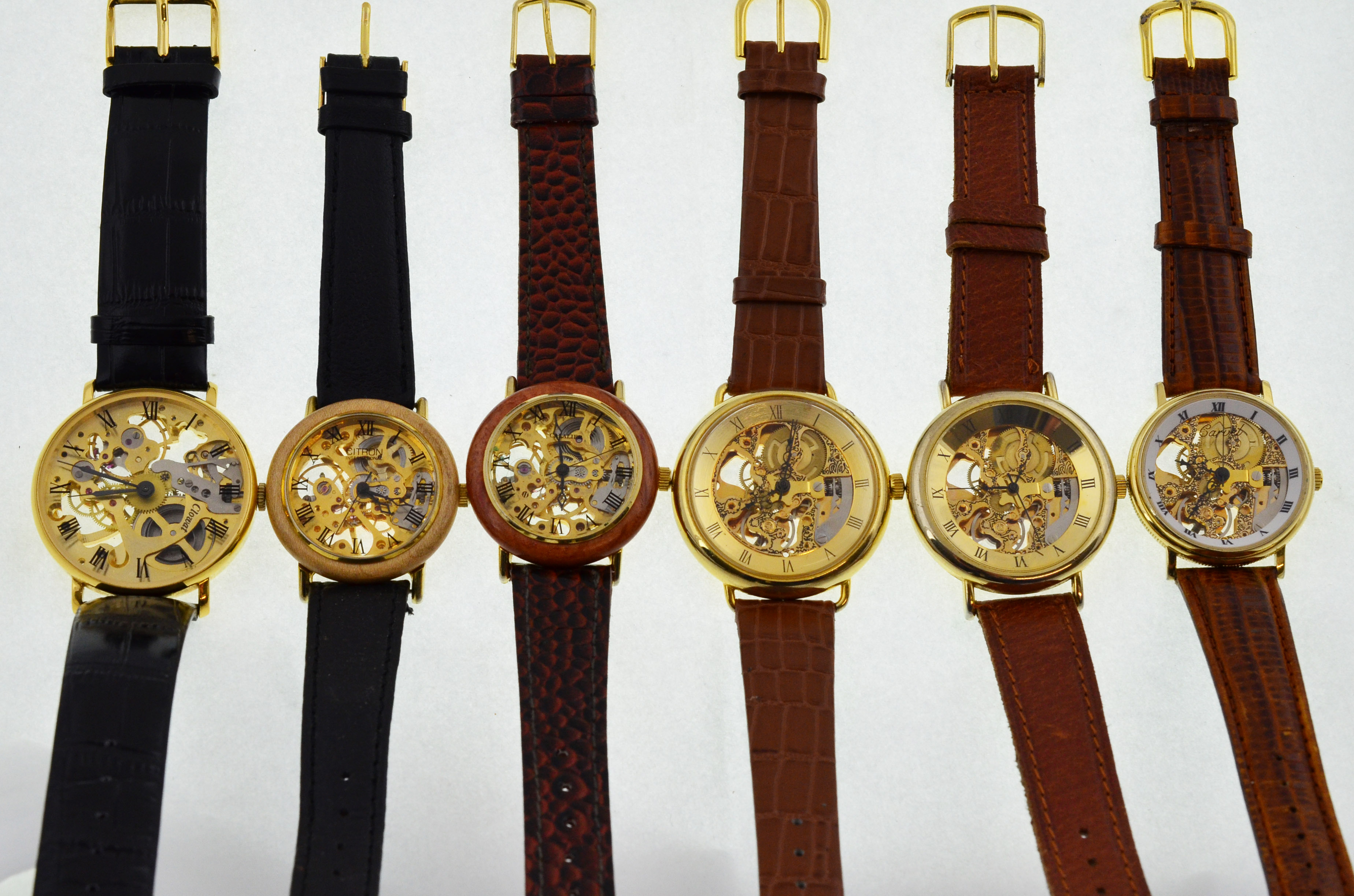 Six modern skeleton gold-plated mechanical wristwatches,