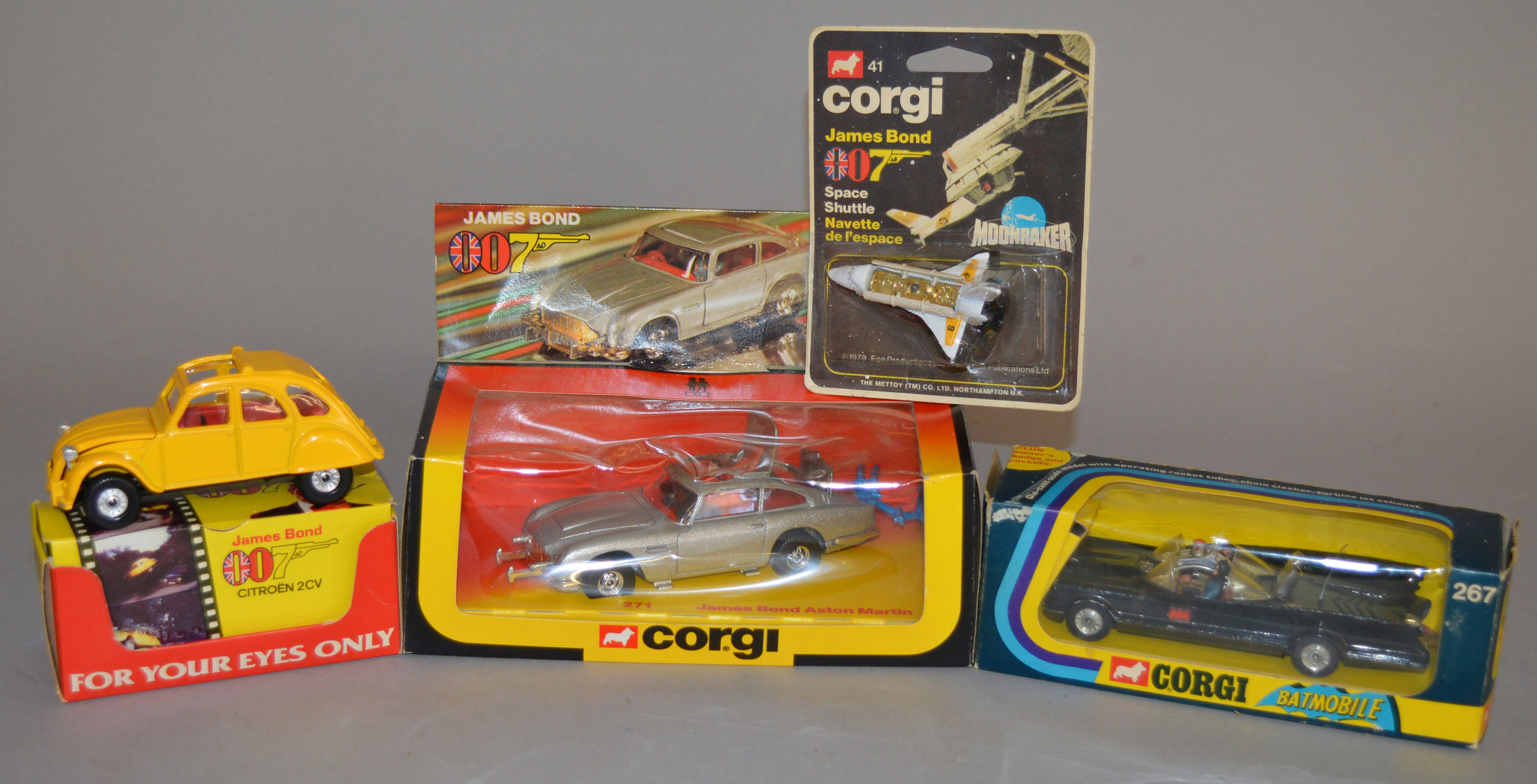 3 boxed Corgi Toys Film and TV related diecast models including 267 'Rocket Firing' Batmobile with