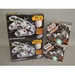 2 Hasbro Star Wars Millennium Falcon models together with 2 Star Wars Tie Bomber models,