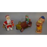 Three unboxed vintage Japanese battery operated tinplate toys including a Modern Toys 'Old Timer