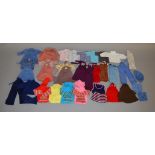 A good selection of vintage dolls clothing, which includes; trousers, skirts, hat etc.