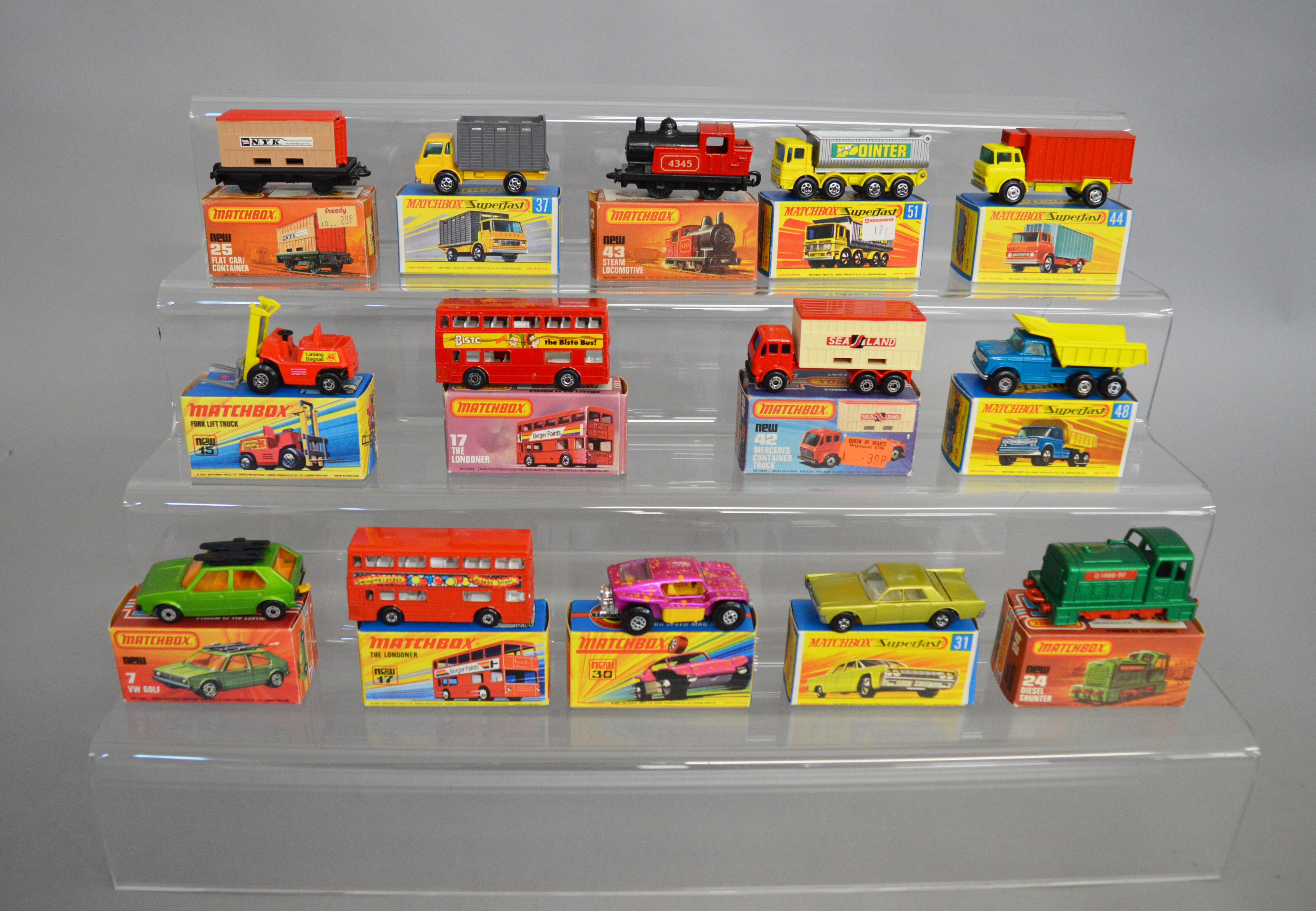 14 boxed Matchbox 1-75 series 'Superfast' models, including 7 VW Golf, 15 Fork Lift,