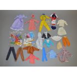 A varied selection of vintage dolls clothing items including a plastic red and white stripe