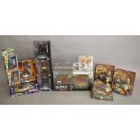 A mixed lot which includes; Back To The Future part 3 1/15th scale time machine, bendable Gizmo,
