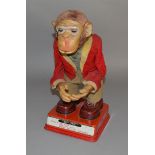 An unboxed and impressive vintage Japanese tinplate battery operated HY-QUE monkey figure by Rosko.