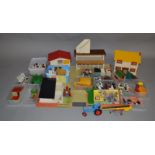 An unboxed Britains Farm including wooden buildings together with a good quantity of plastic