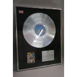 10cc framed silver disc BPI certified sales award to recognise sales of more than £300 000 copies of