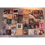 Over 60 picture sleeve 7 inch single vinyl records mainly from the 1980s with artists including