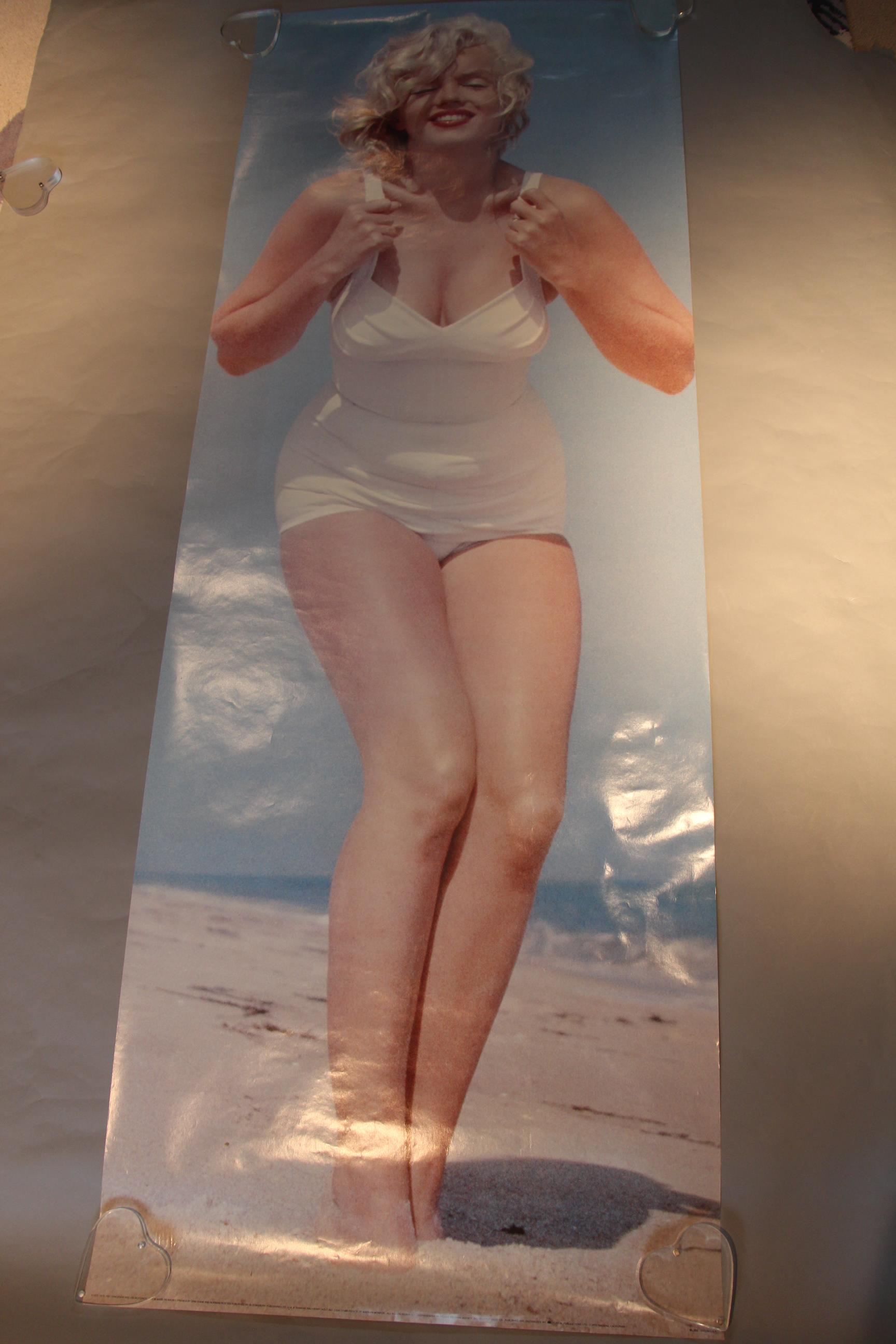 Marilyn Monroe door panel poster picturing Marilyn in a full length photo wearing a white bikini