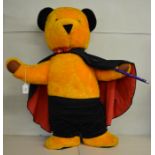 A large 'Sooty' soft toy, dressed as a Magician, approximately 80cm tall. A label attached to the