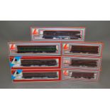 OO Gauge. A boxed LIma 205137MWG Class 117 DMU Locomotive together with 6 boxed maroon Vans of