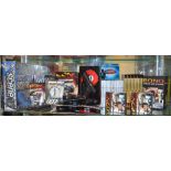 A mixed lot of James Bond 007 items which includes; books,, jigsaw puzzles, postcards, secret