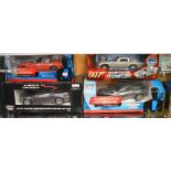 4 James Bond diecast model cars; which includes; Aston Martin V12 Vanquish 1:16 scale etc (4)  [