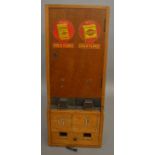 A vintage W.D & H.O.Wills tobacco dispensing machine of wooden construction, machine stands at