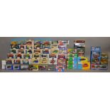 A quantity of boxed diecast models by Corgi, Lledo and others including 9 Vanguards car and van