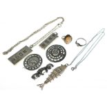 A bagged quantity of silver jewellery to include marcasite & cameo rings, pendants, ingots, brooches