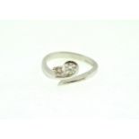 An 18ct H/M two stone Diamond twist set ring, approx total weight 0.50ct, approx colour J/K,