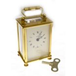 A brass 'Dominion' carriage clock, with key, working