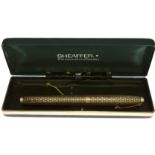 A sterling silver Sheaffer fountain pen with 14k nib, in original box