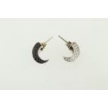A pair of 18ct H/M black and white diamond set claw shaped earrings, approx gross weight 6.6gms