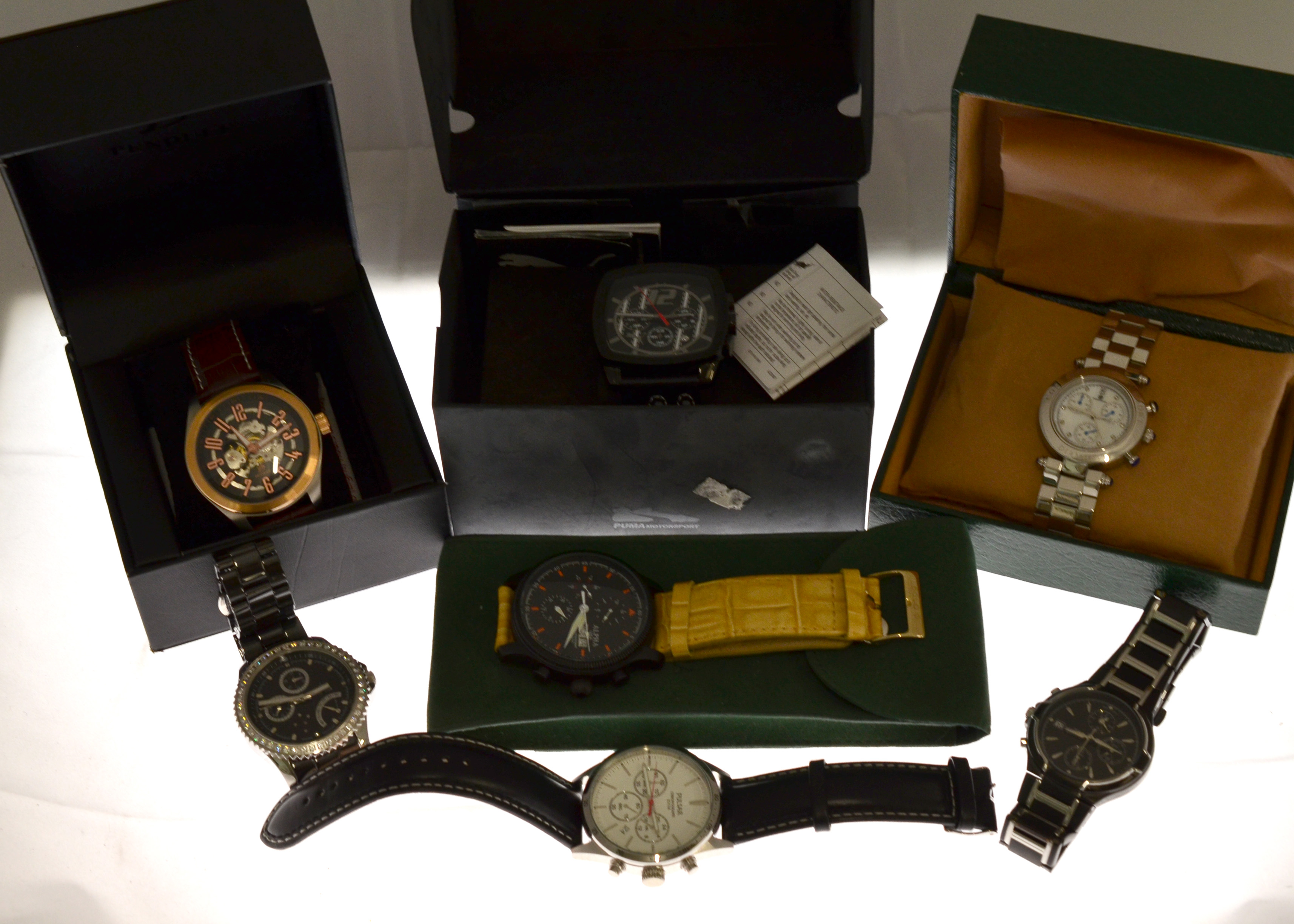 A boxed quantity of seven gents wristwatches to include two quartz Pulsar's, a quartz Puma with box,