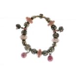 Pandora leather bracelet with twenty one charms/stoppers, most Pandora, approx gross weight 70gms