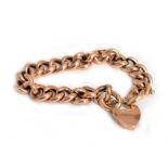 A 9ct H/M rose gold padlock bracelet with safety chain, approx 22gms
