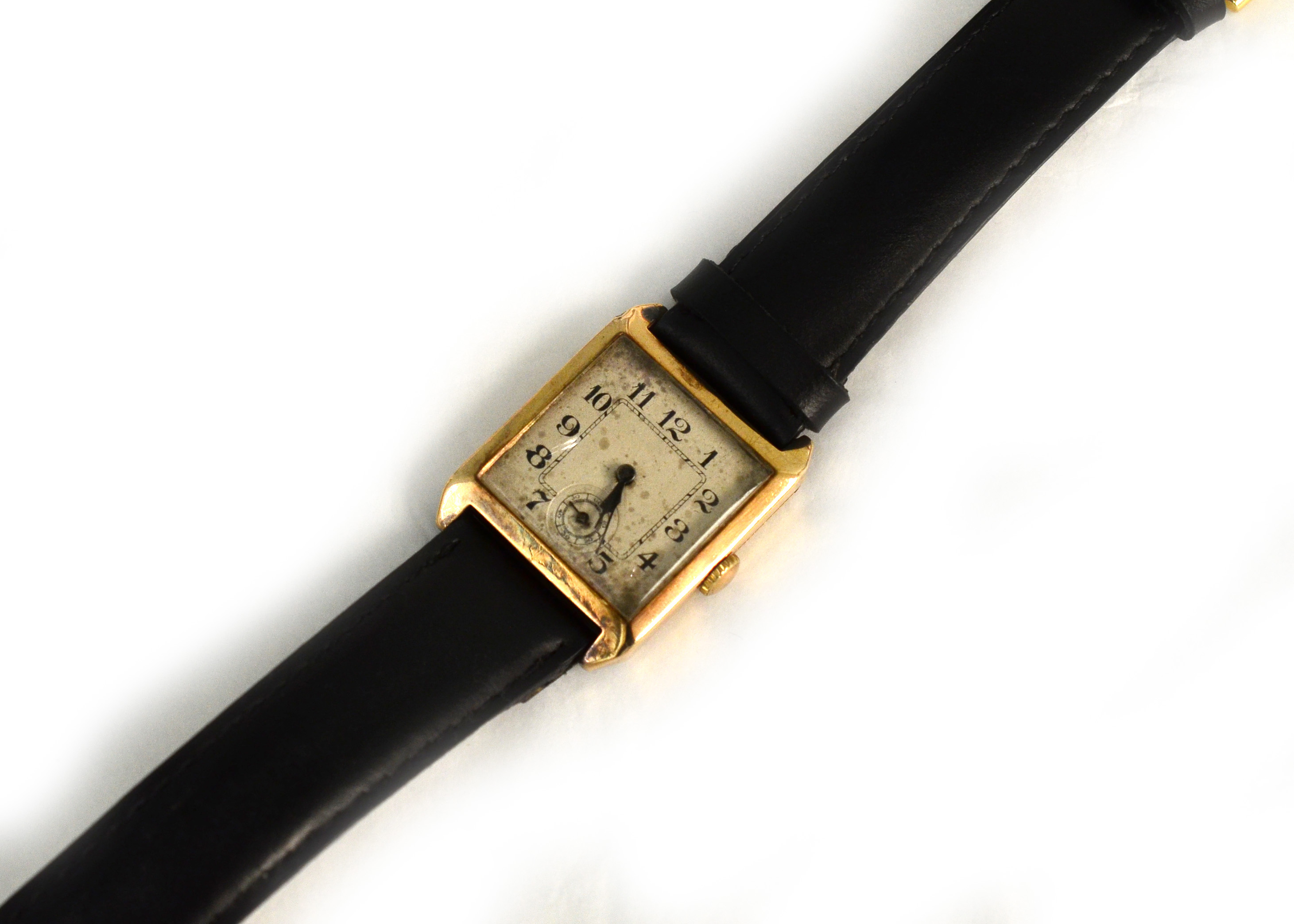 An early 20th century 9ct mechanical wristwatch H/M London 1925, the white dial has no cracks but