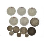 A quantity of silver coins to include five encapsulated modern £5 commemorative, 1887 crown & half