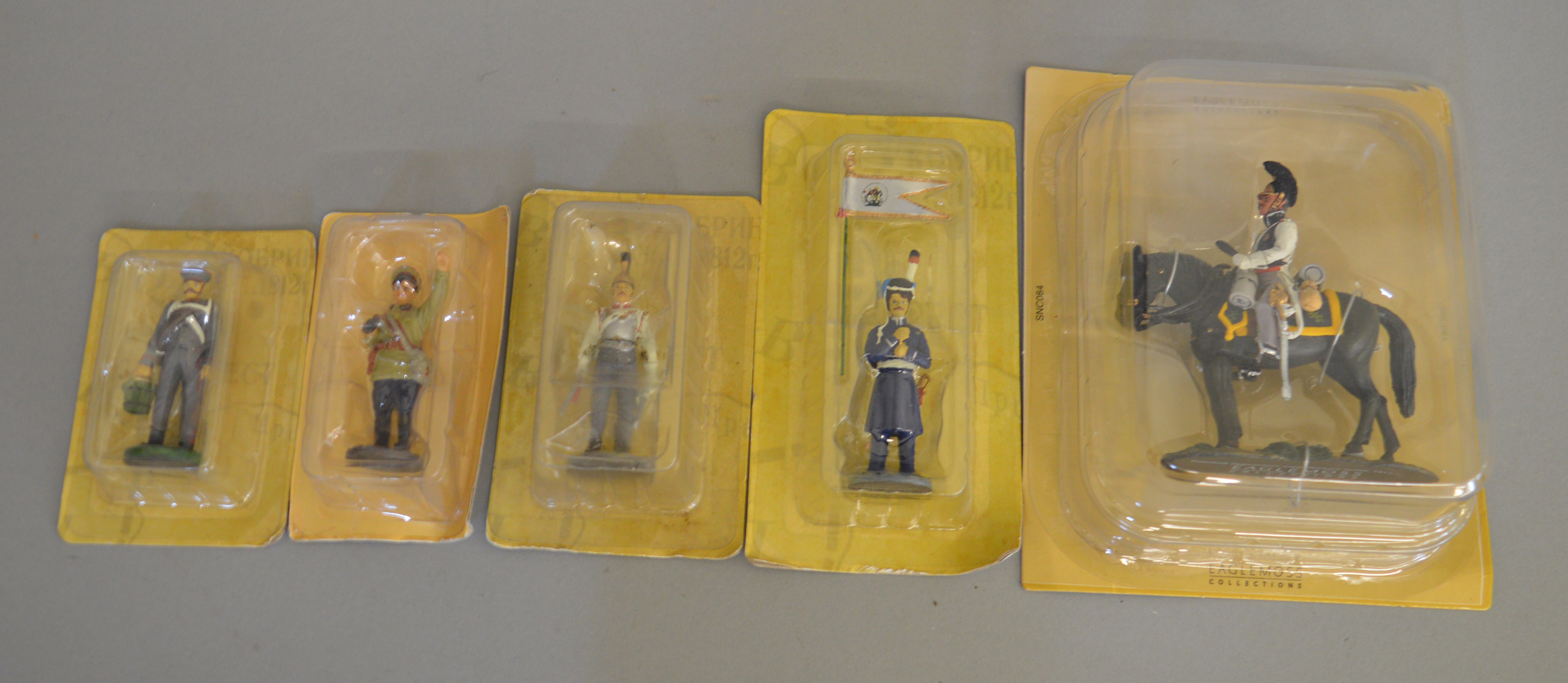 A very good quantity of magazine issue Eaglemoss carded soldier figures which are mostly Russian and