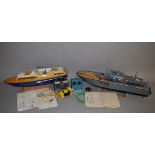 2 remote control boats; K.D. Perkasa which is approx 95cm in length with a stand, instructions and